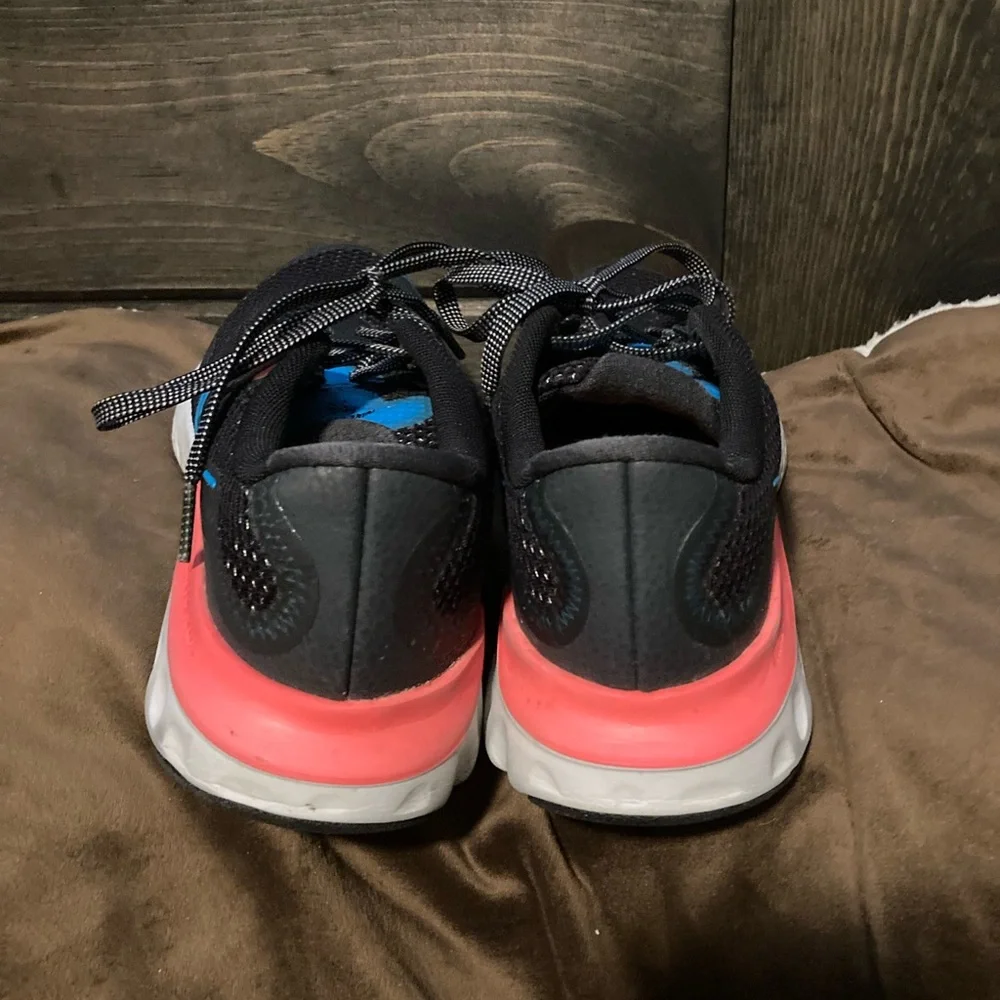 Nike brand, size 6Y, comfortable athletic shoes, black, blue and pink.
